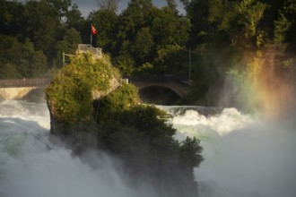 The Rhine Falls at Schaffhausen in Switzerland with rainbow colours and the Middle Rock. An extreme