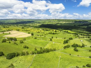 Farms and Fields over Bainbridge Village from a drone, Leyburn, North Yorkshire, England, United