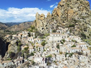 Mountains and Olive groves around Ghost Town from a drone, Pentedattilo Village, Calabria, Italy,