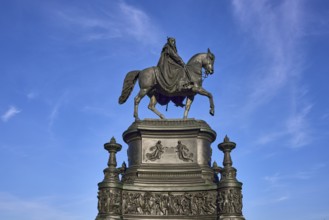 Equestrian statue King John Monument, blue sky with cirrus clouds, Theatre Square, Dresden, state