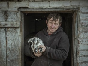 Vova, 46 years old, farmer from Borshchivka with a goatling. The village was under Russian