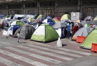 Refugees on 13.04.2016 in a camp in the port of Piraeus, Greece, Europe