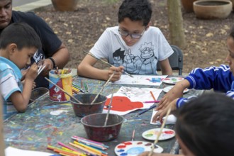 Oaxaca, Mexico, Students painting at a temporary art class in the zocalo, Central America