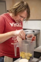 Wheat Ridge, Colorado, Joshua Hudson makes smoothies at his Twisted Smoothie Company