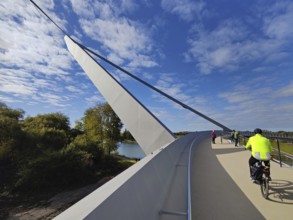 People on the Zügelgurtbruecke bridge jumping over the Emscher with the Rhine-Herne Canal,