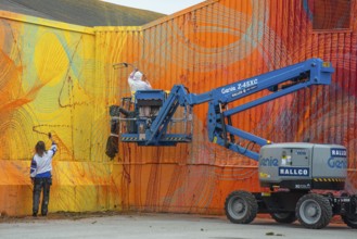 American street artist Douglas Hoekzema, also known as HOXXOH paints a wall in Ystad, Skåne County,