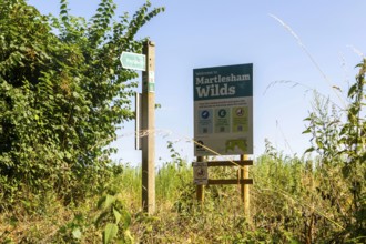 Sign for Martlesham Wilds, Suffolk Wildlife Trust farmland rewilding project, near Woodbridge,