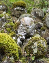 Close-up of moss-covered stone statue of rakan, the disciple of Buddha, Otagi Nenbutsu-ji temple,