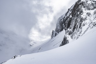 Snow-covered mountain landscape, ascent to the Wildhorn, cloudy mood, high tour, Bernese Alps,