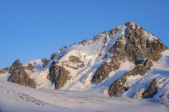 High alpine mountain landscape at sunset, summit of the Aiguille de Chardonnet and Glacier du Tour