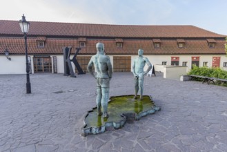 Two male figures peeing, sculpture by the artist David Cerny in front of the Franz Kafka Museum,