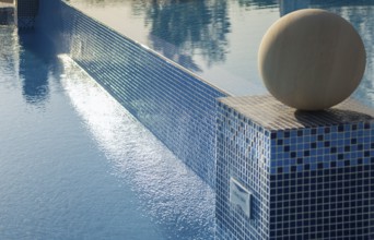 Pool area, water reflections, close-up