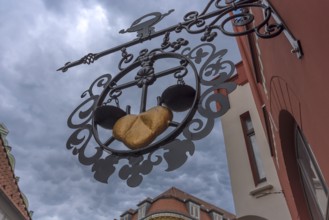 Nose sign of a pharmacy, Wismar, Mecklenburg-Vorpommern, Germany, Europe