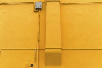 Coloured façade with fireplace in Burano, Venice, Italy, Europe