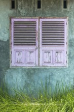 Dilapidated wall with shutter as texture, window, closed, flaked, pastel, pastel, colour mood,