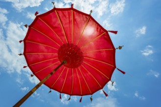 Traditional Balinese temple sunshade as parasol, Hinduism, symbol, beach holiday, protection, sun