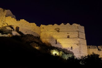 Night shot, A historic castle at night, illuminated and dramatically highlighted against the dark