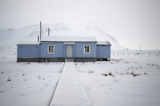 Blue house, winter landscape, research settlement, Ny-Ålesund, Spitsbergen Island, Svalbard and Jan