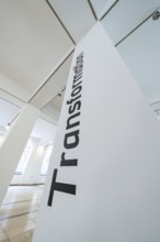 Close-up of an exhibition pillar with the word 'Transformation', University of Stuttgart, Germany,