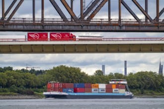 The Beeckerwerth Rhine bridge of the A42 motorway, truck traffic, in front of it the Haus-Knipp