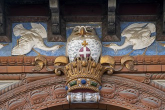 Detail, historic façade with decorative bird reliefs and owl on Danish crown, Carlsberg Museum,