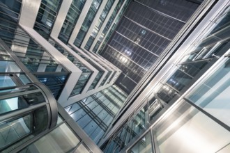 Dynamic architecture with glass structures and illuminated elements at night, Stuttgart, Germany,