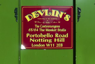 Sign for fruit and vegetable shop Devlin's, Portobello Road, Notting Hill, London, England, Great