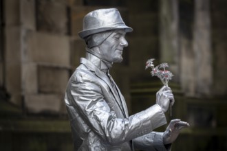 Street artists sprayed with silver paint, world's largest cultural festival The Fringe, High