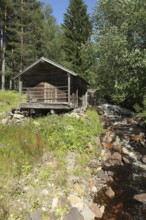 Wooden hut with bubbling brook, Central Sweden, Sweden, Scandinavia, Europe