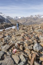 Hiker on scree in winter, Ötztal, Tyrol, Austria, Europe