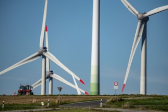 Wind farm near Lichtenau, wind turbines, country road, Driburger Straße, tractor at work in the