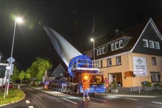 Transport of a 68 metre long, 22 tonne blade of a wind turbine, here in Breckerfeld-Waldbauer, with