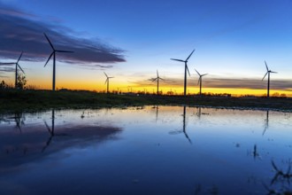 Wind farm near Holzweiler, town of Erkelenz, wind turbines, rain puddle, North Rhine-Westphalia,