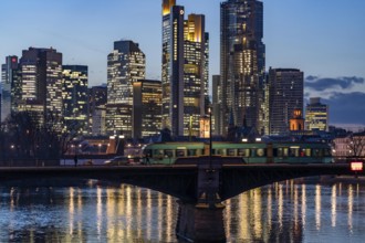 Skyline of the city centre of Frankfurt am Main, river Main, dusk, Ignatz-Bubis-Brücke, Hesse,