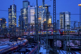 Railway tracks in front of the main railway station in Frankfurt am Main, skyline of skyscrapers in