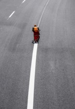 Marking work after the renewal of the road surface on the A40 motorway between the Kaiserberg