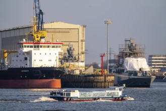 Port of Hamburg, Blohm + Voss shipyard, dredger OSTERIFF and corvette of the German Navy,