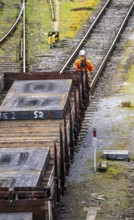 Goods train with steel slabs at the Mülheim-Styrum marshalling yard, on the railway line between