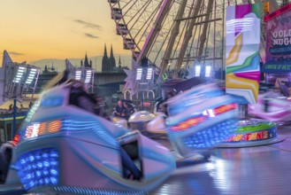 Deutz funfair on the Rhine, at Easter, funfair, break-dancer ride, Ferris wheel, Cologne Cathedral,