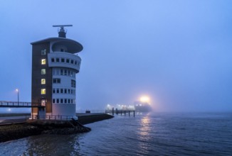 Thick fog in winter, hanging over the mouth of the Elbe into the North Sea, radar tower of the