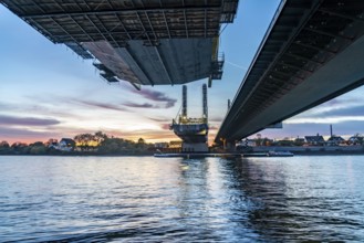 New construction of the motorway bridge Neuenkamp of the A40, over the Rhine near Duisburg, evening