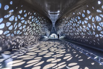 Light effects from the sun in the Parkbruk, a cycle and pedestrian bridge in the city centre of