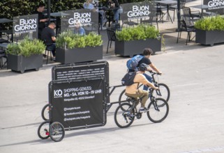 Mobile billboards, pulled by bicycles, advertising for the Kö-Galerie shopping centre in North