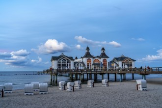 The pier of Sellin, evening mood, sunset, 394 metres long, with restaurant, jetty, beach chairs,