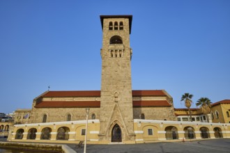 A church with bell tower and arcades under a blue sky, Church of the Annunciation of the Blessed