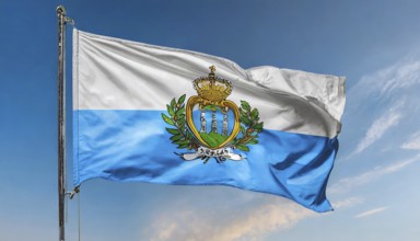 Flags, the national flag of San Marino flutters in the wind