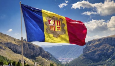 The flag of Andorra flutters in the wind