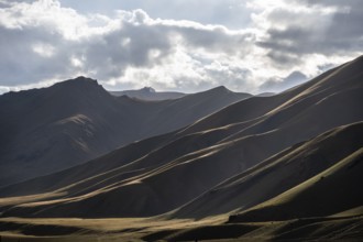 Mountain silhouette and hills in the sunlight, Dramatic mountain landscape, Tian Shan, Sky