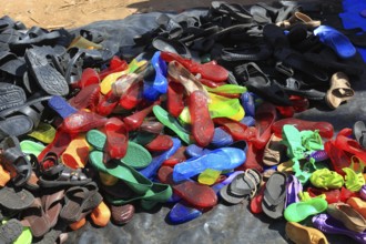 South Ethiopia, market in Jinka, market day, trade with plastic sandals, plastic shoes, market