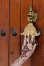 Traditional door knocker in the shape of a hand, hand, tattoo, henna, traditional, door fitting,